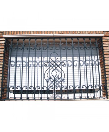 3073 Reja con rizos de forja y adorno sencillo central